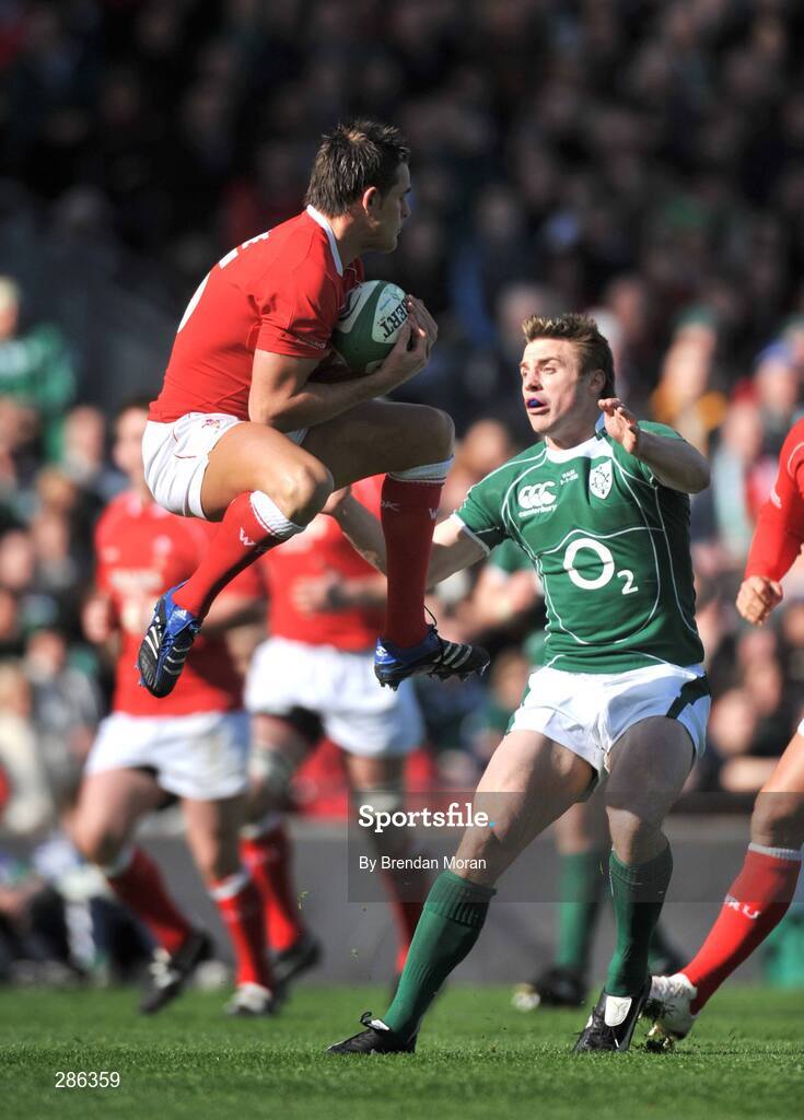 8 March 2008; Lee Byrne, Wales, fields a high ball ahead of Tommy Bowe, Ireland. RBS Six Nations Rugby Championship, Ireland v Wales, Croke Park, Dublin. Picture credit: Brendan Moran / SPORTSFILE