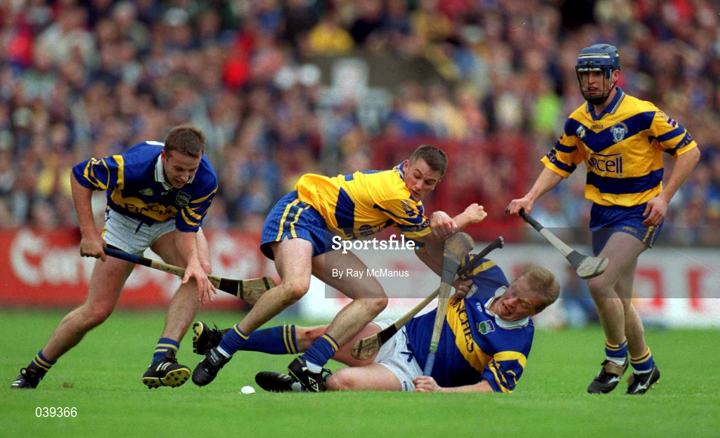 11 June 2000; Brian O'Meara, left, and Declan Ryan of Tipperary in action against Alan Markham and David Forde, right, of Clare during the Guinness Munster Senior Hurling Championship Semi-Final match between Tipperary and Clare at Páirc Uí Chaoimh in Cork. Photo by Ray McManus/Sportsfile