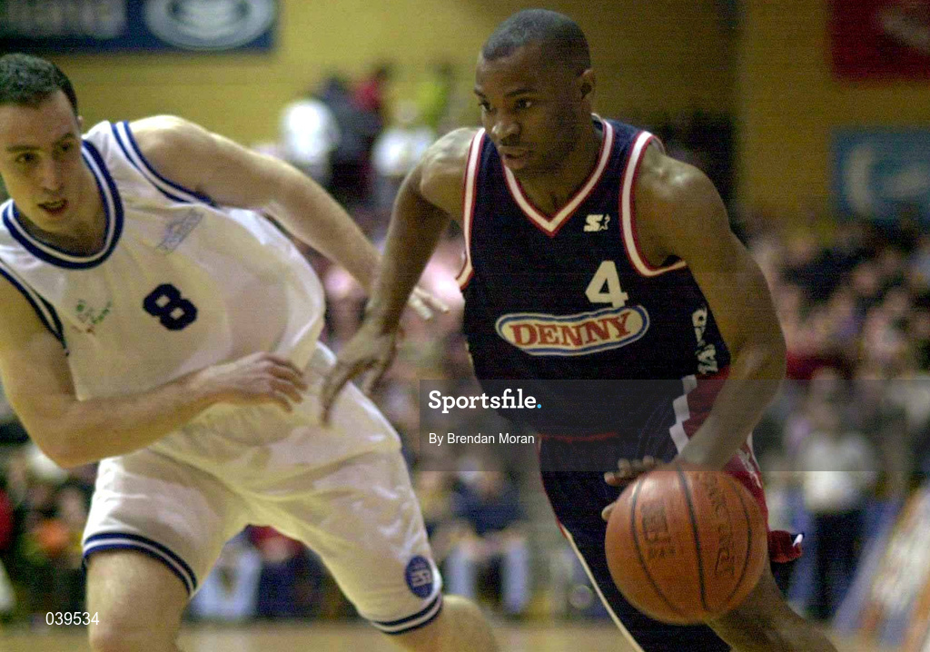 30 January 2000; Denny Notre Dame's Brian Benjamin in action against Dave Donnelly of St Vincent's during the Sprite Cup Men's Final match between Denny Notre Dame and St Vincent's at the National Basketball Arena in Tallaght, Dublin. Photo by Brendan Moran/Sportsfile