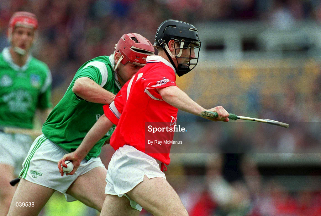 4 June 2000; Brian Corcoran of Cork in action against TJ Ryan of Limerick during the Guinness Munster Senior Hurling Championship Semi-Final match between Cork and Limerick at Semple Stadium in Thurles, Tipperary. Photo by Ray McManus/Sportsfile