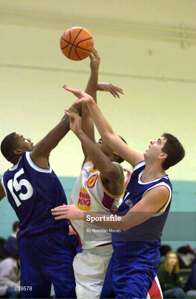 4 December 1999; Kareem Lewis of BK Limerick in action against Ferdinand Williams, 15, and Brian Tonkovich of St Vincent's during the ESB Men's Superleague Basketball match between St Vincent's and BK Limerick at St Vincent's Basketball Club in Glasnevin, Dublin. Photo by Brendan Moran/Sportsfile