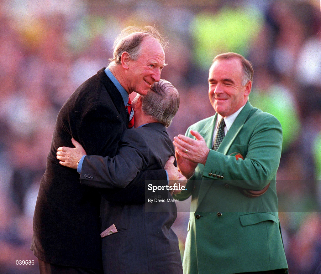 30 May 2000; Republic of Ireland equipment officer Charlie O'Leary, centre, is embraced by former Republic of Ireland manager Jack Charlton, left, after he was presented with a momento for his services to Irish soccer, as Pat Quigley, President of the Football Association of Ireland, watches on during the International Friendly match between Republic of Ireland and Scotland at Lansdowne Road in Dublin. Photo by David Maher/Sportsfile