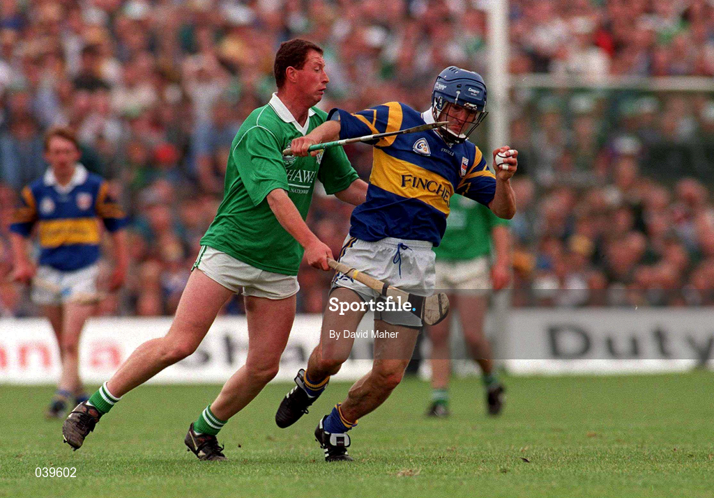 7 July 1996; Tipperary's Colm Bonnar holds off the challenge of Frankie Carroll of Limerick during the Guinness Munster Senior Hurling Championship Final between Limerick and Tipperary at the Gaelic Grounds in Limerick. Photo by David Maher/Sportsfile