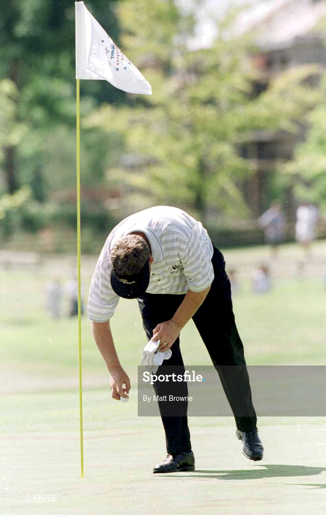 1 August 1999; Darren Clarke collects his ball from the hole after he shot a hole-in-one at the 5th during day three of the Smurfit European Open at The K Club in Straffan, Kildare. Photo by Matt Browne/Sportsfile