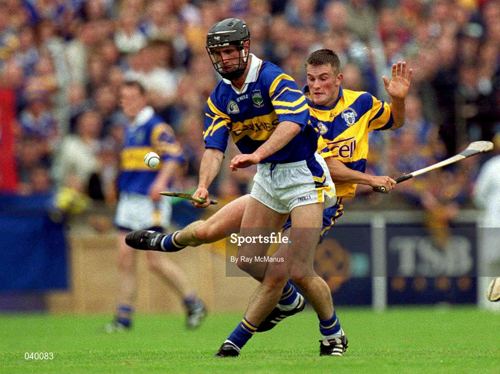 11 June 2000; Tommy Dunne of Tipperary in action against Alan Markham of Clare during the Guinness Munster Senior Hurling Championship Semi-Final match between Tipperary and Clare at Páirc Uí Chaoimh in Cork. Photo by Ray McManus/Sportsfile
