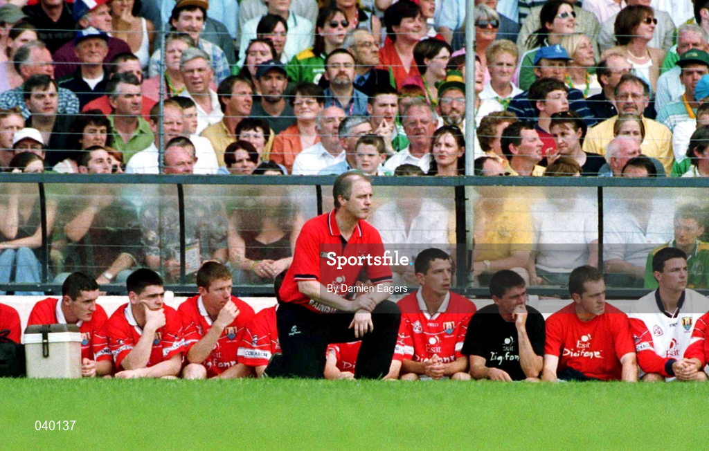 18 June 2000; Cork manager Larry Tompkins kneels next to the bench after been issued with a warning by referee Mick Curley during the Bank of Ireland Munster Senior Football Championship Semi-Final match between Kerry and Cork at Fitzgerald Stadium in Killarney, Kerry. Photo by Damien Eagers/Sportsfile
