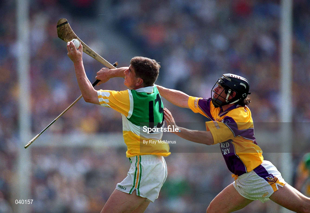 18 June 2000; Michael Duignan of Offaly in action against Sean Flood of Wexford during the Guinness Leinster Senior Hurling Championship Semi-Final match between Offaly and Wexford at Croke Park in Dublin. Photo by Ray McManus/Sportsfile