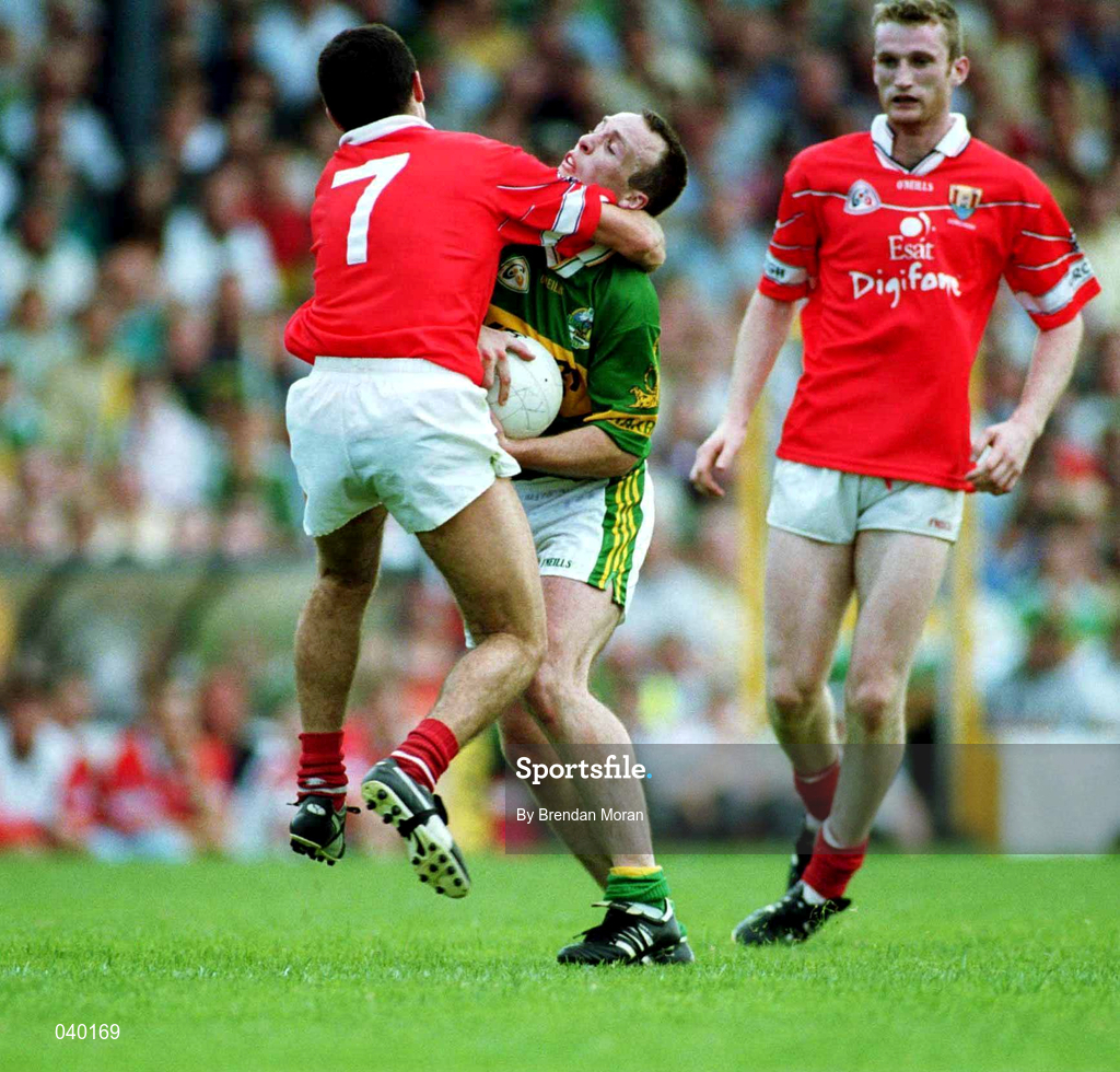 18 June 2000; John Crowley of Kerry is tackled by Martin Cronin of Cork during the Bank of Ireland Munster Senior Football Championship Semi-Final match between Kerry and Cork at Fitzgerald Stadium in Killarney, Kerry. Photo by Brendan Moran/Sportsfile