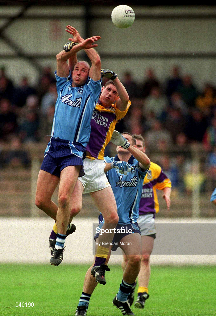 11 June 2000; Brian Stynes of Dublin in action against Tom Howlin of Wexford during the Bank of Ireland Leinster Senior Football Championship Quarter-Final match between Dublin and Wexford at Croke Park in Dublin. Photo by Brendan Moran/Sportsfile