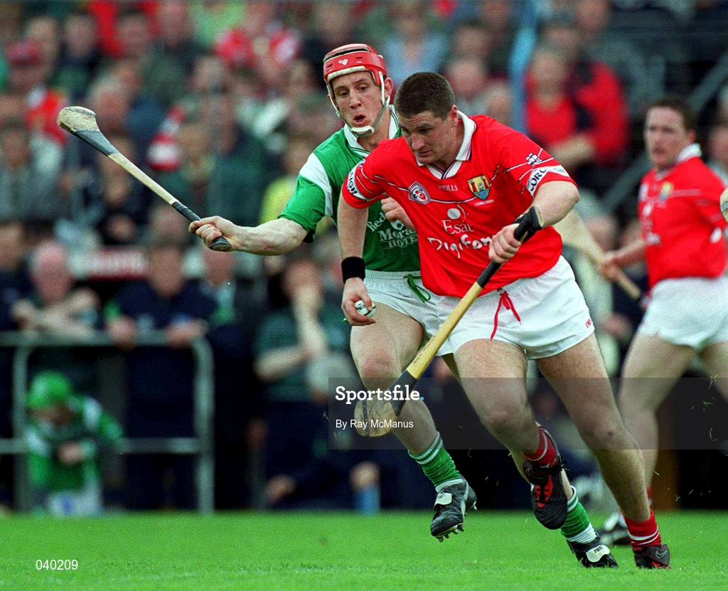 4 June 2000; Fergal McCormack of Cork in action against Ollie Moran of Limerick during the Guinness Munster Senior Hurling Championship Semi-Final match between Cork and Limerick at Semple Stadium in Thurles, Tipperary. Photo by Ray McManus/Sportsfile