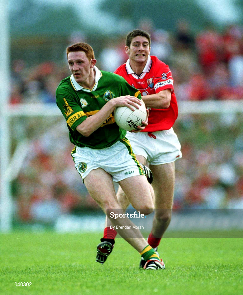 18 June 2000; Noel Kennelly of Kerry in action against Bernard Collins of Cork during the Bank of Ireland Munster Senior Football Championship Semi-Final match between Kerry and Cork at Fitzgerald Stadium in Killarney, Kerry. Photo by Brendan Moran/Sportsfile
