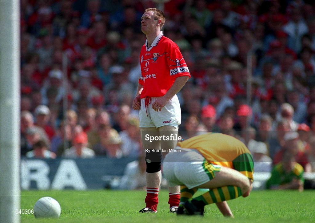 18 June 2000; Kerry goalkeeper Declan O'Keeffe goes to the ground after a challenge by Cork's Philip Clifford which resulted in the Cork player being given a yellow card by referee Mick Curley during the Bank of Ireland Munster Senior Football Championship Semi-Final match between Kerry and Cork at Fitzgerald Stadium in Killarney, Kerry. Photo by Brendan Moran/Sportsfile
