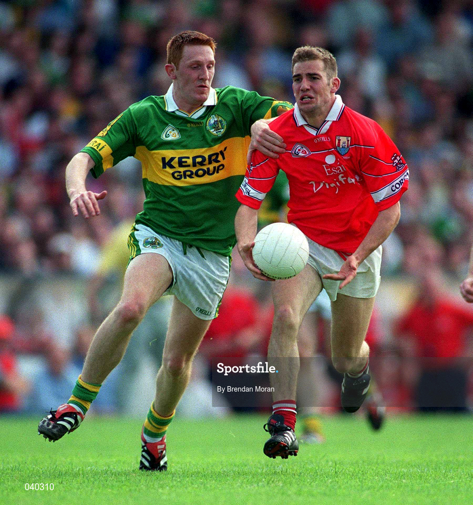 18 June 2000; Kieran Daly of Cork in action against Noel Kennelly of Kerry during the Bank of Ireland Munster Senior Football Championship Semi-Final match between Kerry and Cork at Fitzgerald Stadium in Killarney, Kerry. Photo by Brendan Moran/Sportsfile