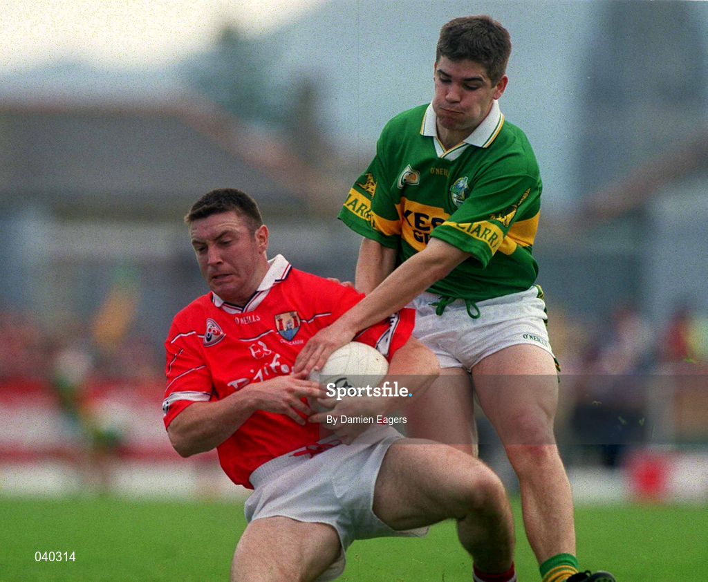 18 June 2000; Joe Kavanagh of Cork in action against Eamonn Fitzmaurice of Kerry during the Bank of Ireland Munster Senior Football Championship Semi-Final match between Kerry and Cork at Fitzgerald Stadium in Killarney, Kerry. Photo by Damien Eagers/Sportsfile