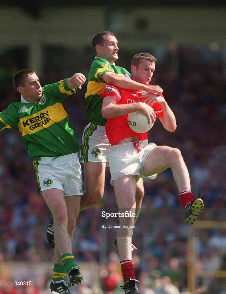 18 June 2000; Nicholas Murphy of Cork in action against Darragh Ó Sé, left, and Donal Daly of Kerry during the Bank of Ireland Munster Senior Football Championship Semi-Final match between Kerry and Cork at Fitzgerald Stadium in Killarney, Kerry. Photo by Damien Eagers/Sportsfile