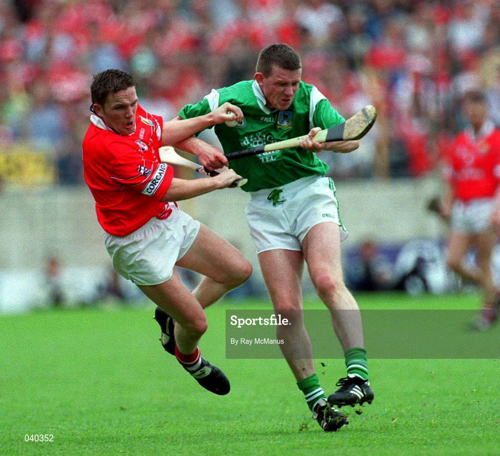 4 June 2000; Mark Foley of Limerick in action against Michael O'Connell of Cork during the Guinness Munster Senior Hurling Championship Semi-Final match between Cork and Limerick at Semple Stadium in Thurles, Tipperary. Photo by Ray McManus/Sportsfile