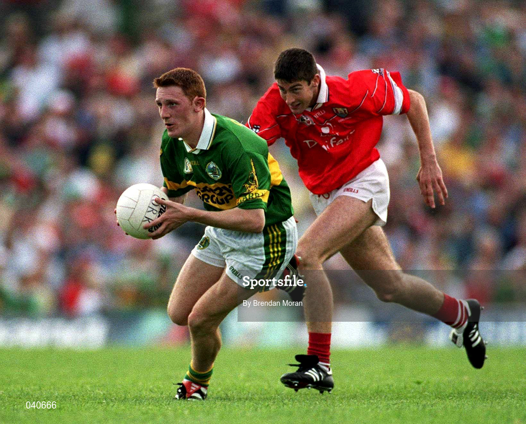18 June 2000; Noel Kennelly of Kerry in action against Bernard Collins of Cork during the Bank of Ireland Munster Senior Football Championship Semi-Final match between Kerry and Cork at Fitzgerald Stadium in Killarney, Kerry. Photo by Brendan Moran/Sportsfile