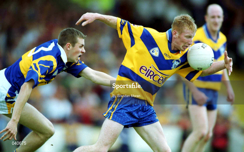 25 June 2000; Ronan Slattery of Clare in action against Niall Fitzgerald of Tipperary during the Bank of Ireland Munster Senior Football Championship Semi-Final match between Clare and Tipperary at the Gaelic Grounds in Limerick. Photo by Brendan Moran/Sportsfile