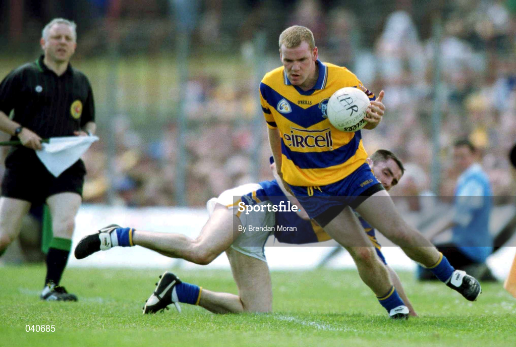 25 June 2000; Dessie Molohan of Clare avoids the challenge of Tipperary's Sean Maher during the Bank of Ireland Munster Senior Football Championship Semi-Final match between Clare and Tipperary at the Gaelic Grounds in Limerick. Photo by Brendan Moran/Sportsfile