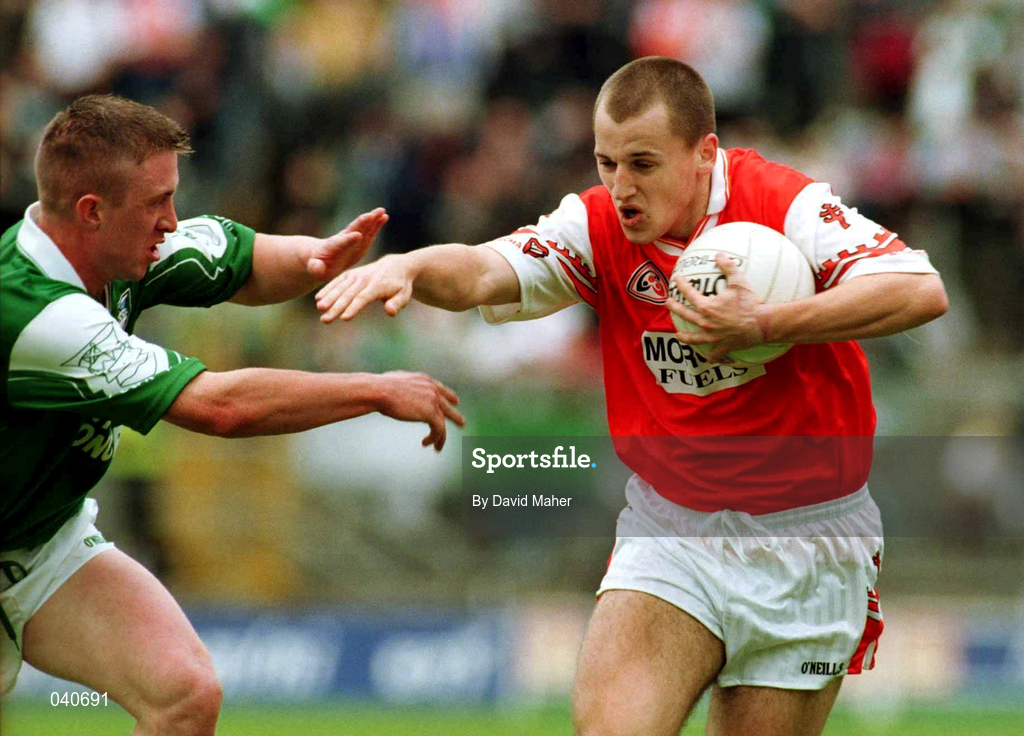 25 June 2000; Paddy McKeever of Armagh in action against Sean Burns of Fermanagh during the Bank of Ireland Ulster Senior Football Championship Semi-Final match between Armagh and Fermanagh at at St Tiernach's Park in Clones, Monaghan. Photo by David Maher/Sportsfile
