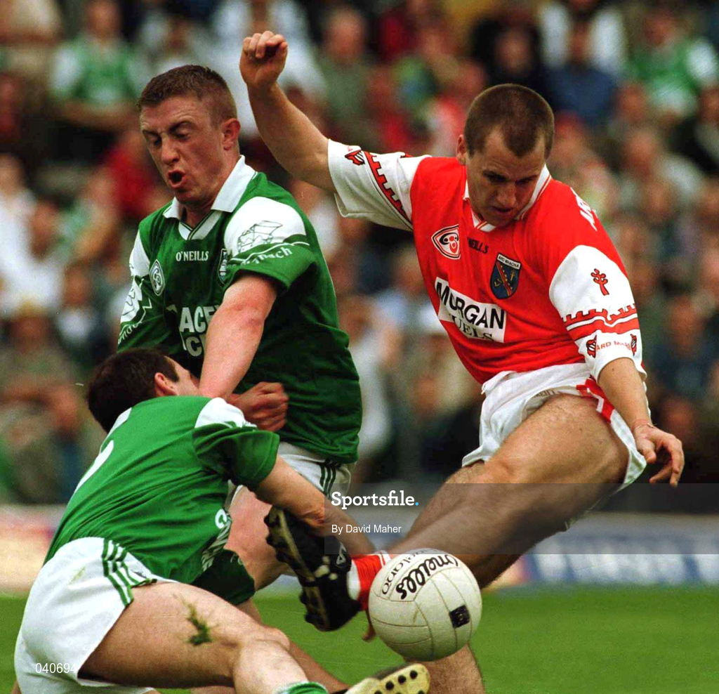 25 June 2000; Paddy McKeever of Armagh in action against Tommy Callaghan and Justin Gilheaney of Fermanagh during the Bank of Ireland Ulster Senior Football Championship Semi-Final match between Armagh and Fermanagh at at St Tiernach's Park in Clones, Monaghan. Photo by David Maher/Sportsfile