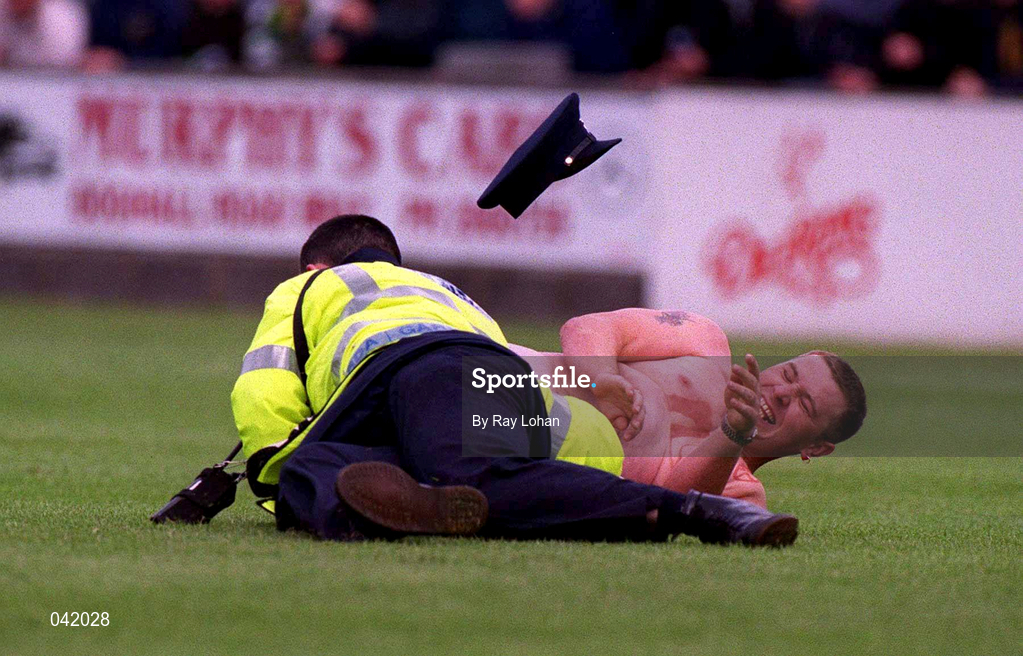 9 July 2000; A streaker is tackled by a member of An Garda Síochána during the Pre-Season Friendly match between Bray Wanderers and Celtic at the Carlisle Grounds in Bray, Wicklow. Photo by Ray Lohan/Sportsfile