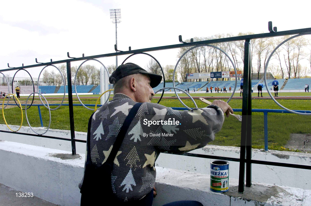 27 April 2004; A painter paints the railings around the pitch during a Republic of Ireland training session at WKS Zawisza Stadium in Bydgoszcz, Poland. Photo by David Maher/Sportsfile