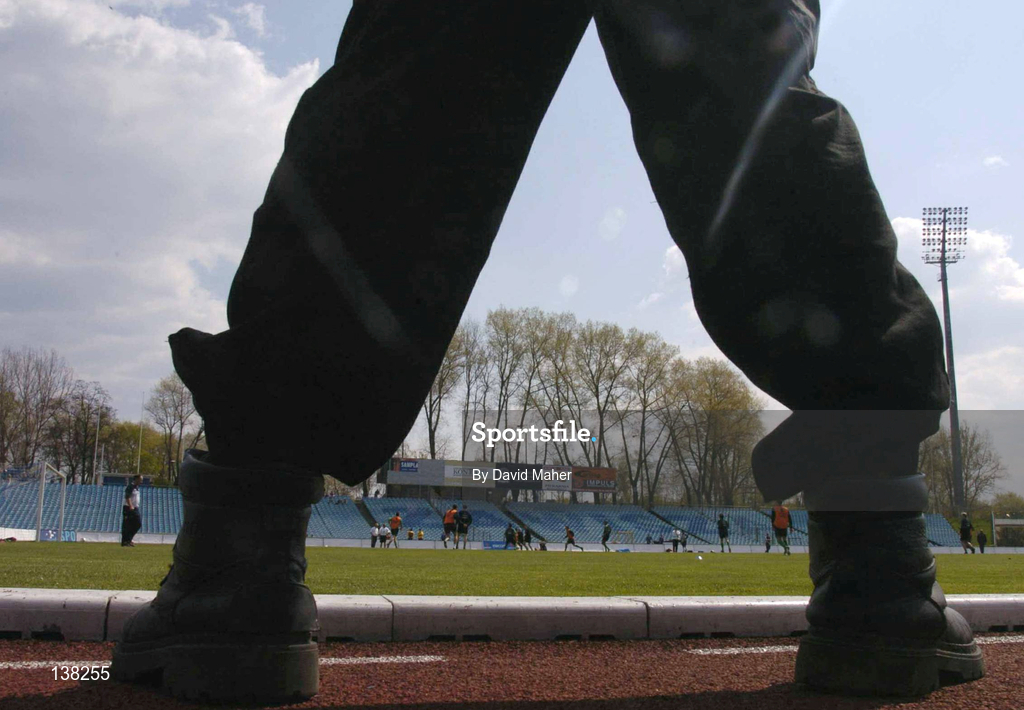 27 April 2004; A view of training through the boots of a security guard during a Republic of Ireland training session at WKS Zawisza Stadium in Bydgoszcz, Poland. Photo by David Maher/Sportsfile
