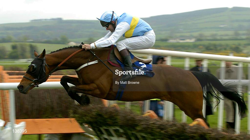 30 April 2004; Hardy Eustace, with Conor O'Dwyer up, jumps the last on their way to winning the Emo Oil Champion Hurdle at Punchestown Racecourse in Kildare. Photo by Matt Browne/Sportsfile