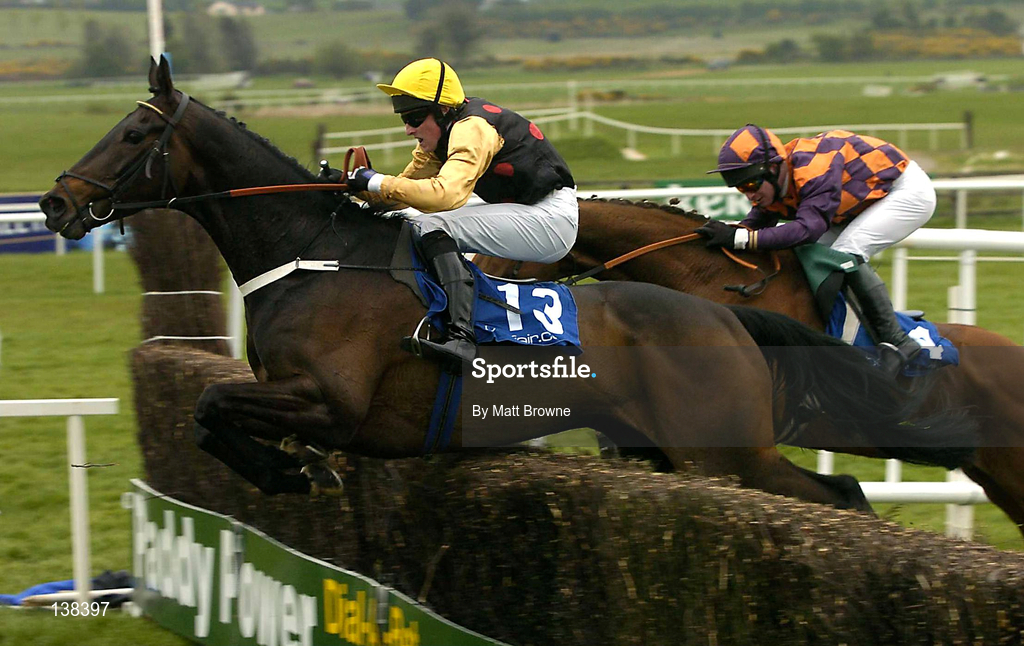 30 April 2004; Liscannor Lad, with Paddy Flood up, 13, jumps the last on their way to winning the Sharp Minds Betfair Novice Handicap Chase, from second placed Ride The Storm, with Mark Grant up, at Punchestown Racecourse in Kildare. Photo by Matt Browne/Sportsfile