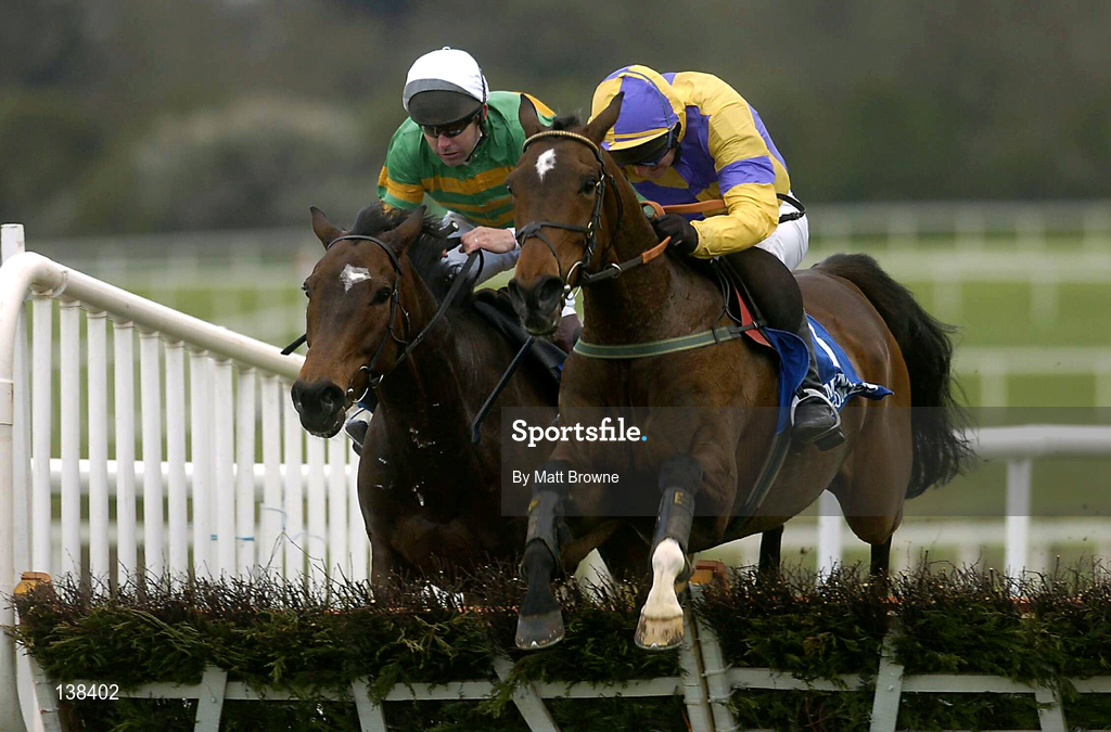 30 April 2004; Sadlers Wings, with Ruby Walsh up, right, jumps the last on their way to winning the Menolly Homes Champion Novice Hurdle, from second placed Kadiskar, with Conor O'Dwyer up, at Punchestown Racecourse in Kildare. Photo by Matt Browne/Sportsfile