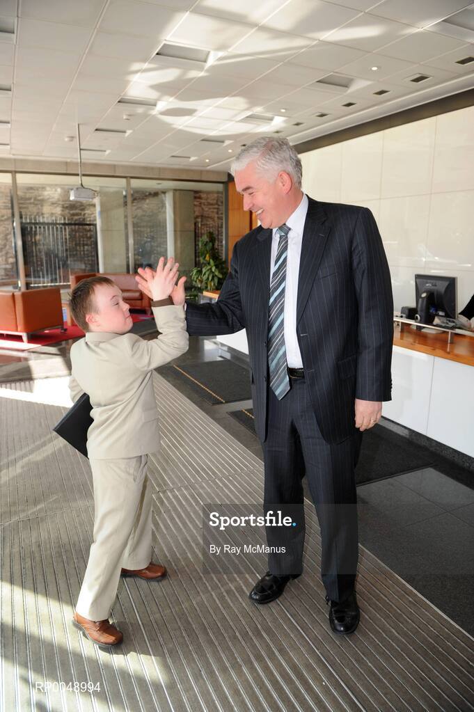 12 March 2008; Ten-year-old Special Olympics athlete Josh Hennessy, from Speisialta Special Olympics Club, Clondalkin, 'seals the deal' with Cathal Magee, Managing Director, eircom Retail, at the announcement that eircom has renewed its sponsorship of Special Olympics Ireland for another four years. eircom offices, St. Stephen's Green, Dublin. Picture credit: Ray McManus / SPORTSFILE