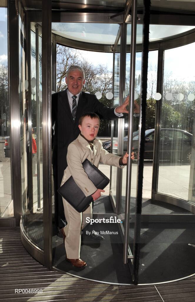 12 March 2008; Ten-year-old Special Olympics athlete Josh Hennessy, from Speisialta Special Olympics Club, Clondalkin, 'seals the deal' with Cathal Magee, Managing Director, eircom Retail, at the announcement that eircom has renewed its sponsorship of Special Olympics Ireland for another four years. eircom offices, St. Stephen's Green, Dublin. Picture credit: Ray McManus / SPORTSFILE