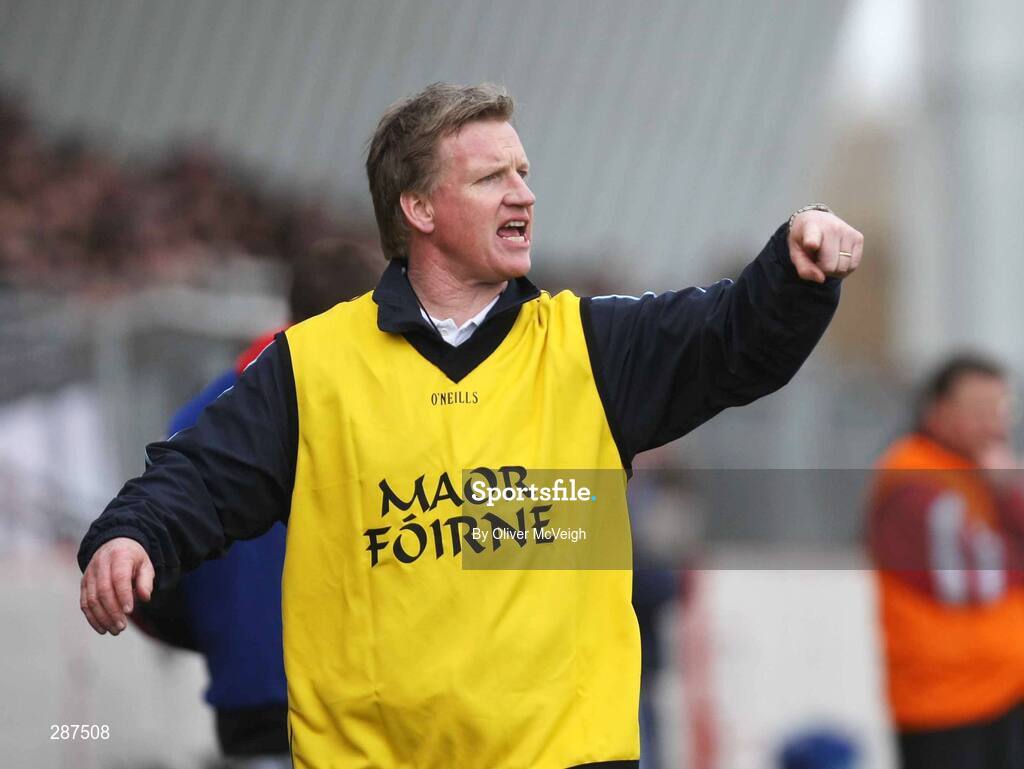 17 March 2008; St. Michael's Enniskillen manager Dominic Corrigan tries to get instructions to his players. Bank of Ireland MacRory Cup Final, St. Michael's Enniskillen V St. Patrick's Academy Dungannon, Healy Park, Omagh, Co Tyrone. Picture credit; Oliver McVeigh / SPORTSFILE