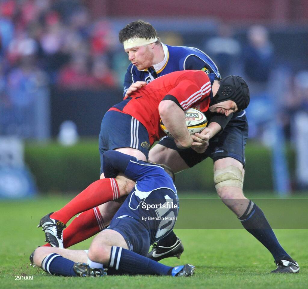 12 April 2008; Denis Leamy, Munster, is tackled by Jonathan Sexton, 10, and Malcolm O'Kelly, Leinster. Magners League, Leinster v Munster, RDS, Ballsbridge, Dublin. Picture credit: Brendan Moran / SPORTSFILE