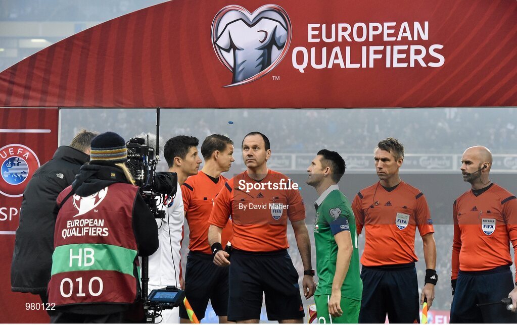 29 March 2015; Referee Jonas Eriksson tosses the coin between captains Robbie Keane, Republic of Ireland, and Robert Lewandowski, Poland. UEFA EURO 2016 Championship Qualifier, Group D, Republic of Ireland v Poland. Aviva Stadium, Lansdowne Road, Dublin. Picture credit: David Maher / SPORTSFILE