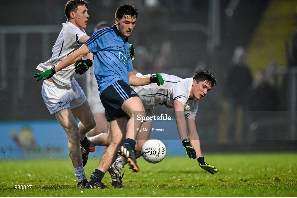 2 April 2015; Colm Basquel, Dublin, shoots to score his side's first goal, despite the efforts of Kildare's Brian Byrne, left, and David Hyland. EirGrid Leinster U21 Football Championship Final, Dublin v Kildare. Páirc Táilteann, Navan, Co. Meath. Picture credit: Matt Browne / SPORTSFILE