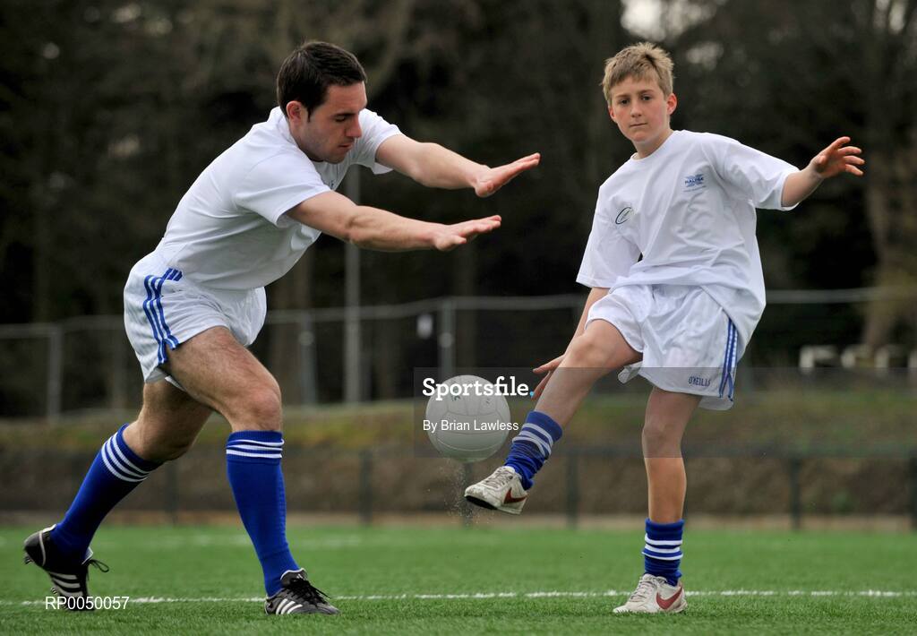 8 April 2008; Halifax has unveiled ten top inter-county stars as Brand Ambassadors to support the Halifax GaelicPerformance Summer Camps in 2008. The role of the ambassadors will include attending the camps and developing a specially designed Gaelic Skills training poster for children as well as other initiatives to be launched over the coming month. The ambassadors include Alan Kerins, Galway, Declan O'Sullivan, Kerry, Stephen Bray, Meath, Bernard Brogan, Dublin, Sean Cavanagh, Tyrone, James Masters, Cork, Alan Dillon, Mayo, Paul Casey, Dublin and Paul Finlay, Monaghan and Dublin ladies football captain Cliodhna O'Connor. Pictured is Kevin Wade, from St Fintan's School, Sutton, Dublin, having his shot blocked down by Declan O'Sullivan, Kerry. University College Dublin, Belfield, Dublin. Picture credit: Brian Lawless / SPORTSFILE