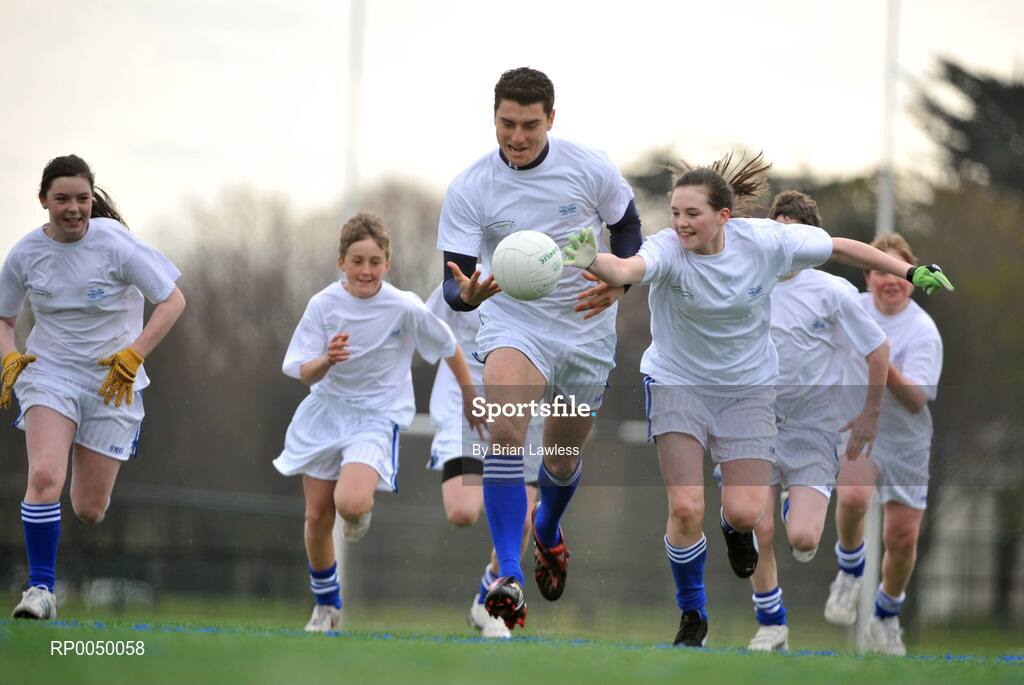 8 April 2008; Halifax has unveiled ten top inter-county stars as Brand Ambassadors to support the Halifax GaelicPerformance Summer Camps in 2008. The role of the ambassadors will include attending the camps and developing a specially designed Gaelic Skills training poster for children as well as other initiatives to be launched over the coming month. The ambassadors include Alan Kerins, Galway, Declan O'Sullivan, Kerry, Stephen Bray, Meath, Bernard Brogan, Dublin, Sean Cavanagh, Tyrone, James Masters, Cork, Alan Dillon, Mayo, Paul Casey, Dublin and Paul Finlay, Monaghan and Dublin ladies football captain Cliodhna O'Connor. Pictured is Bernard Brogan, Dublin, being chased by, from left, Hollie Minehan, Kevin Wade, and Emma McDonagh, all from St Fintan's School, Sutton, Dublin. University College Dublin, Belfield, Dublin. Picture credit: Brian Lawless / SPORTSFILE