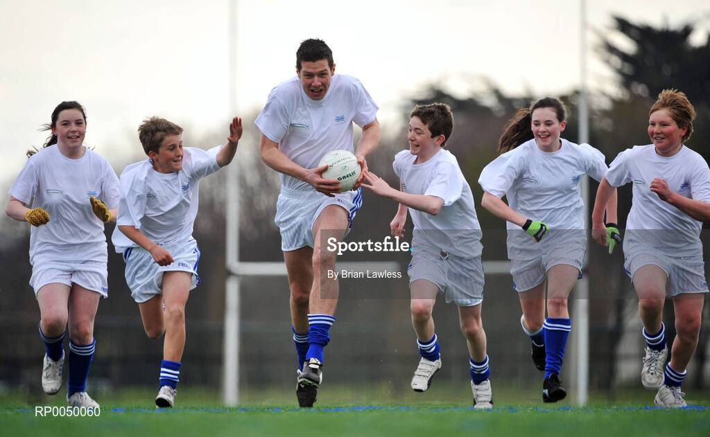 8 April 2008; Halifax has unveiled ten top inter-county stars as Brand Ambassadors to support the Halifax GaelicPerformance Summer Camps in 2008. The role of the ambassadors will include attending the camps and developing a specially designed Gaelic Skills training poster for children as well as other initiatives to be launched over the coming month. The ambassadors include Alan Kerins, Galway, Declan O'Sullivan, Kerry, Stephen Bray, Meath, Bernard Brogan, Dublin, Sean Cavanagh, Tyrone, James Masters, Cork, Alan Dillon, Mayo, Paul Casey, Dublin and Paul Finlay, Monaghan and Dublin ladies football captain Cliodhna O'Connor. Pictured is Sean Cavanagh, Tyrone, being chased by, from left, Hollie Minehan, Kevin Wade, Ronan McDyer, Emma McDonagh and Sean Brodie, all from St Fintan's School, Sutton, Dublin. University College Dublin, Belfield, Dublin. Picture credit: Brian Lawless / SPORTSFILE