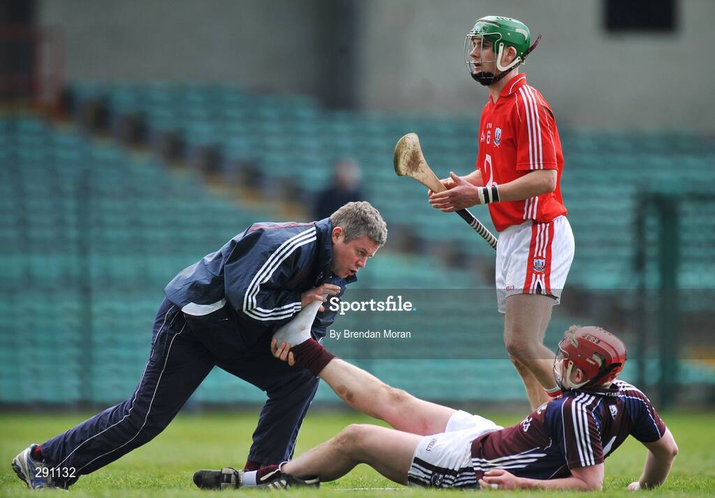 13 April 2008; Joe Canning, Galway, is attended to by a member of the team medical staff as Eoin Cadogan, Cork, tstands by. Allianz National Hurling League, Division 1, semi-final, Cork v Galway, Gaelic Grounds, Limerick. Picture credit: Brendan Moran / SPORTSFILE