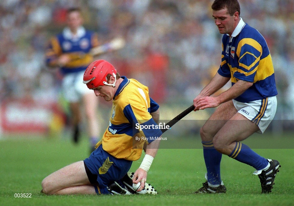 14 September 1997; Brian Lohan of Clare in action against Michael Cleary of Tipperary during the GAA Munster Senior Hurling Championship Final match between Clare and Tipperary at Páirc Uí Chaoimh, Cork. Photo by Ray McManus/Sportsfile *** Local Caption ***
