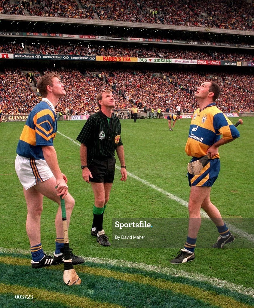 14 September 1997; Referee Dickie Murphy performs the coin toss between Tipperary captain Conor Gleeson, left, and Clare captain Anthony Daly prior to the Guinness All Ireland Hurling Final match between Clare and Tipperary at Croke Park in Dublin. Photo by David Maher/Sportsfile