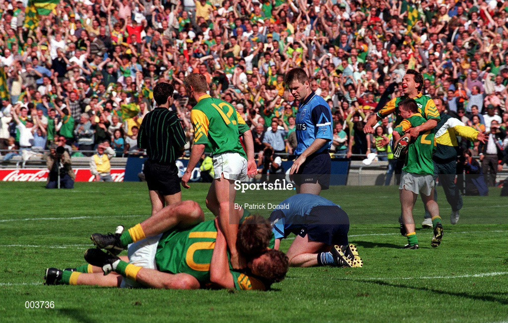 15 June 1997; Meath players celebrate as Paul Bealin of Dublin holds his head in agony after the GAA Senior Football Championship Quarter-Final match between Meath and Dublin at Croke Park in Dublin. Photo by Patrick Donald/Sportsfile