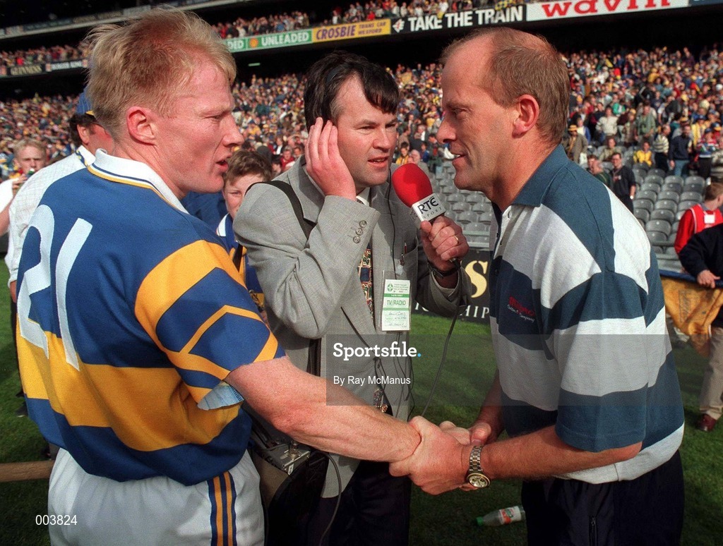 14 September 1997; Clare manager Ger Loughnane, alongside RTE's Brian Carthy, is congratulated by Aidan Ryan of Tipperary after the Guinness All Ireland Hurling Final match between Clare and Tipperary at Croke Park in Dublin. Photo by Ray McManus/Sportsfile