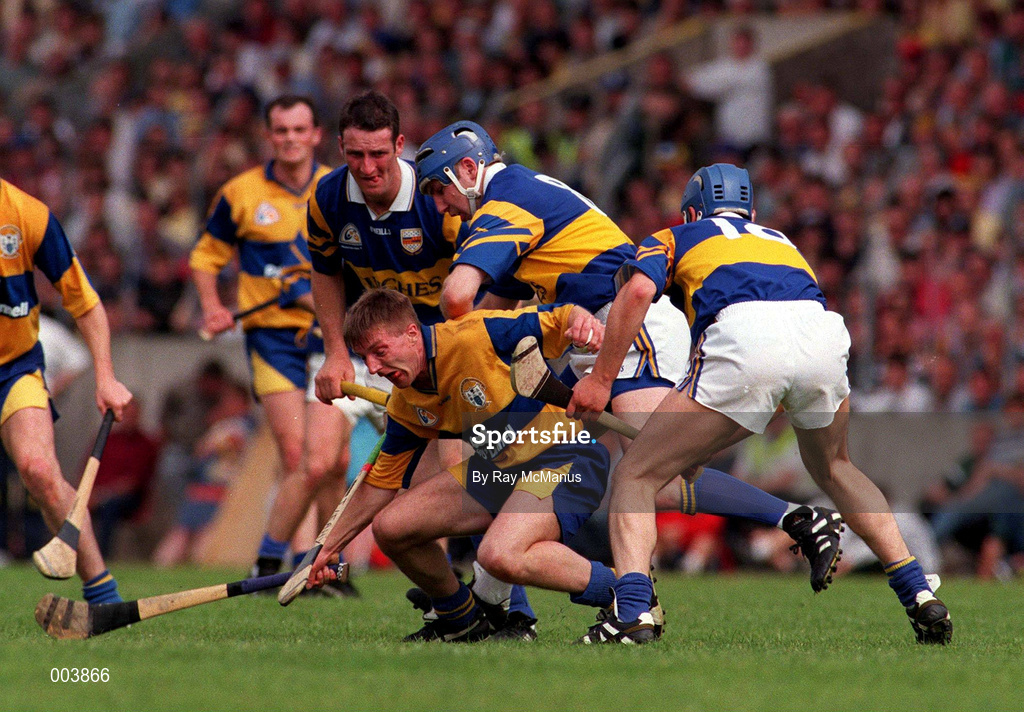 6 July 1997; James O'Connor of Clare in action against John Leahy, Aiden Butler and Conal Bonnar, 18, of Tipperary during the Guinness Munster Senior Hurling Championship Final match between Clare and Tipperary at Páirc Uí Chaoimh in Cork. Photo by Ray McManus/Sportsfile