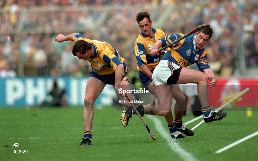 14 September 1997; Ollie Baker of Clare, left, with team-mate P.J O'Connell in action against Liam McGrath of Tipperary during the Guinness All-Ireland Senior Hurling Championship Final between Clare and Tipperary at Croke Park in Dublin. Photo by David Maher/Sportsfile