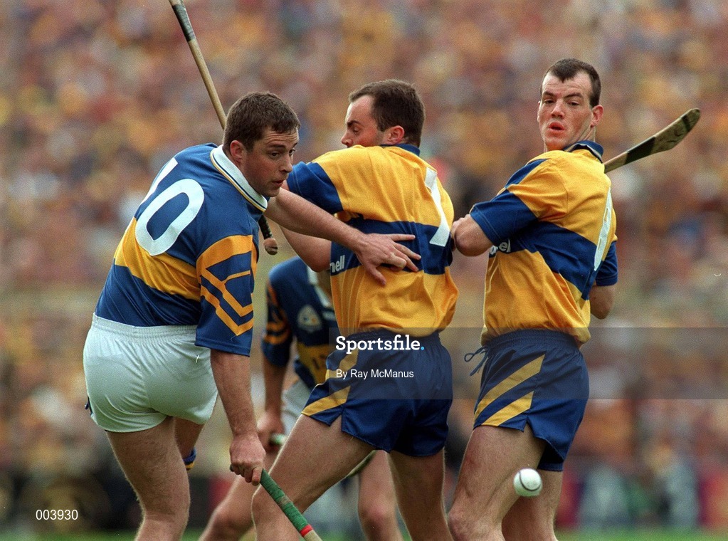 14 September 1997; Liam McGrath of Tipperary in action against Anthony Daly and Ollie Baker of Clare during the Guinness All Ireland Hurling Final match between Clare and Tipperary at Croke Park in Dublin. Photo by Ray McManus/Sportsfile
