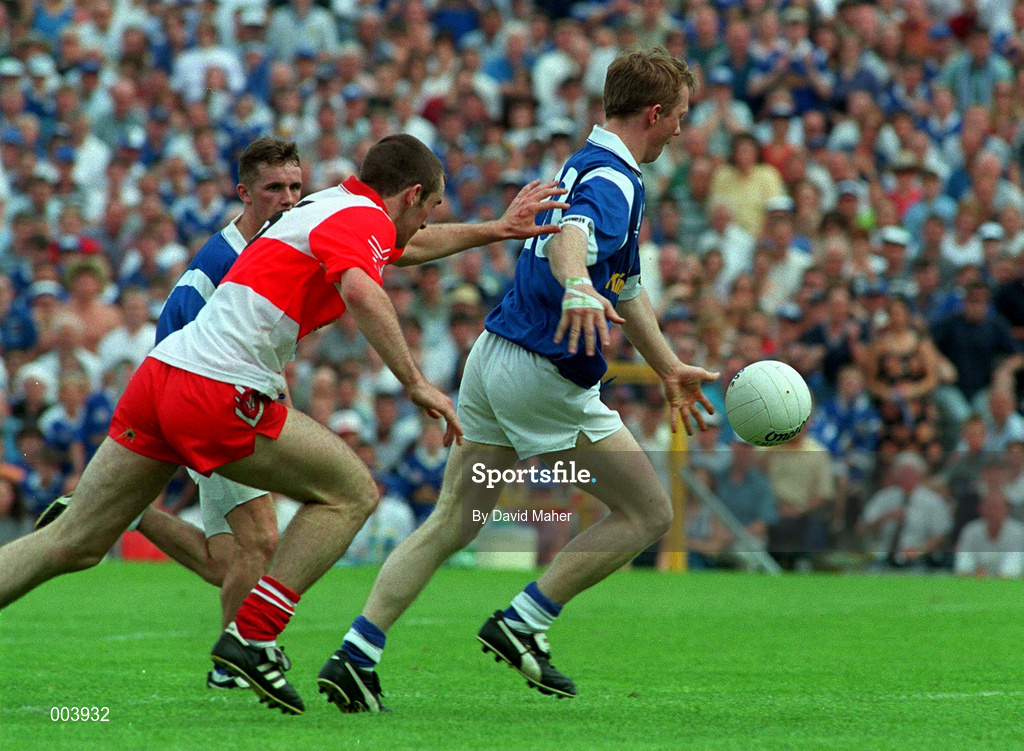 20 July 1997; Jason Reilly of Cavan shoots to score the winning goal for Cavan, despite the attentions of David O'Neill of Derry during the Ulster GAA Football Senior Championship Final match between Cavan and Derry at St. Tiernach's Park in Clones, Monaghan. Photo by David Maher/Sportsfile