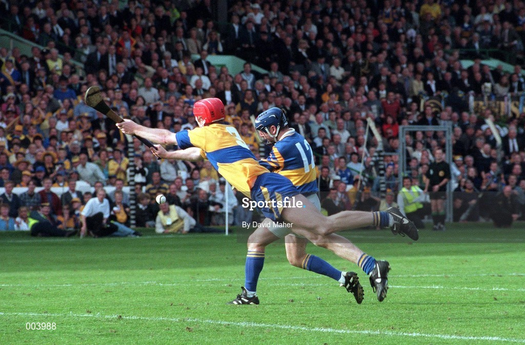 14 September 1997; John Leahy of Tipperary has a shot on goal in the final moments of the game despite the attempts of Brian Lohan of Clare during the Guinness All Ireland Hurling Final match between Clare and Tipperary at Croke Park in Dublin. Photo by David Maher/Sportsfile